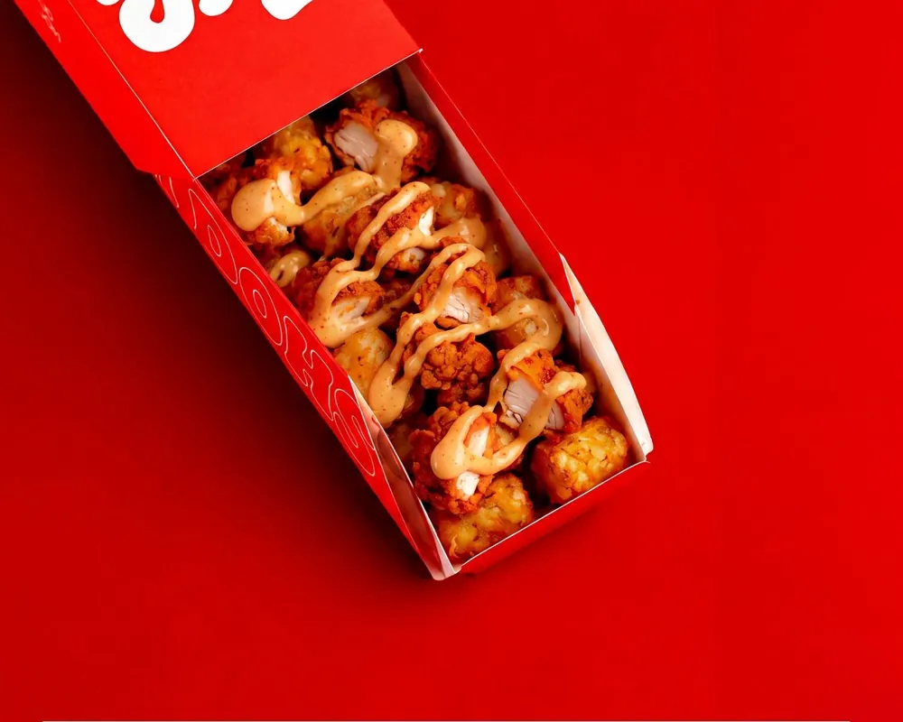 Dough Dohs Nashville Chicken Loaded Tots in a branded red box