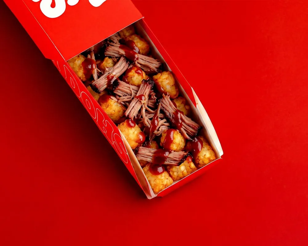 Dough Dohs Brisket Loaded BBQ Tots in a branded red box