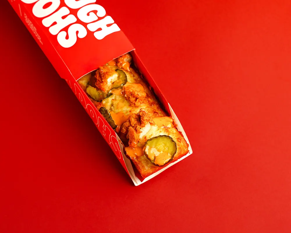 Dough Dohs Nashville pizza in its branded red box