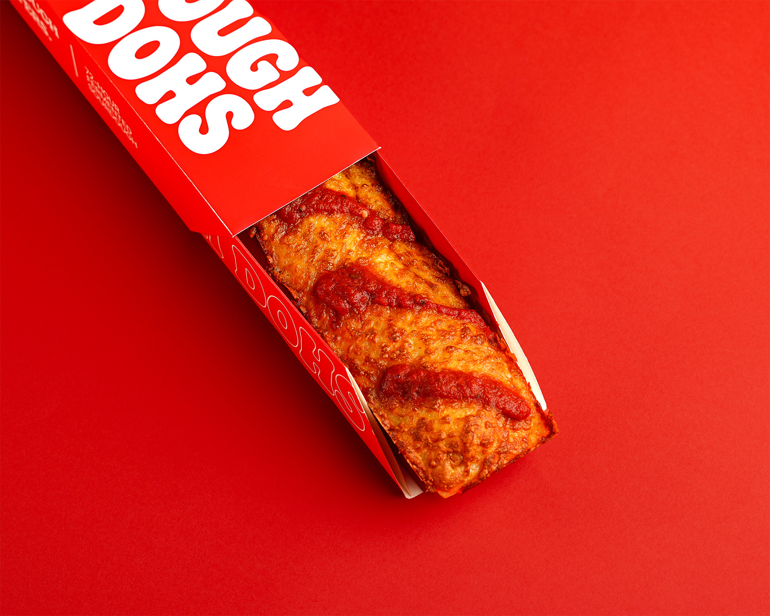 Dough Dohs The Red Stripe pizza in its branded red box