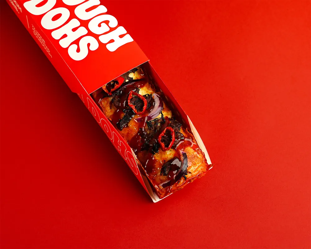 Dough Dohs The Rib pizza in its branded red box